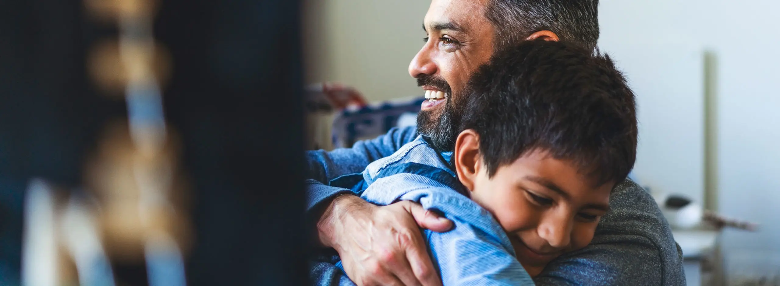 dad hugging child