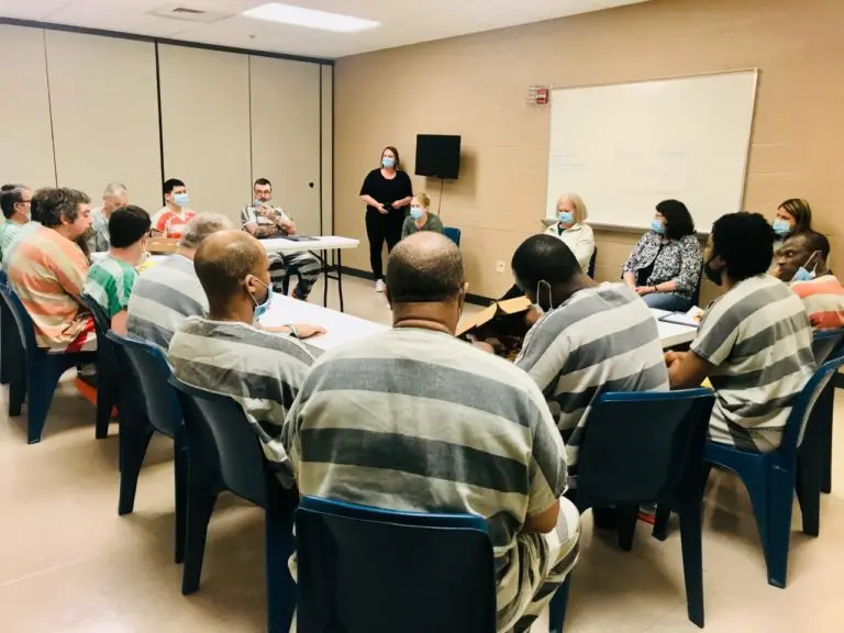 Men Listening to Presentation on Reentry Services